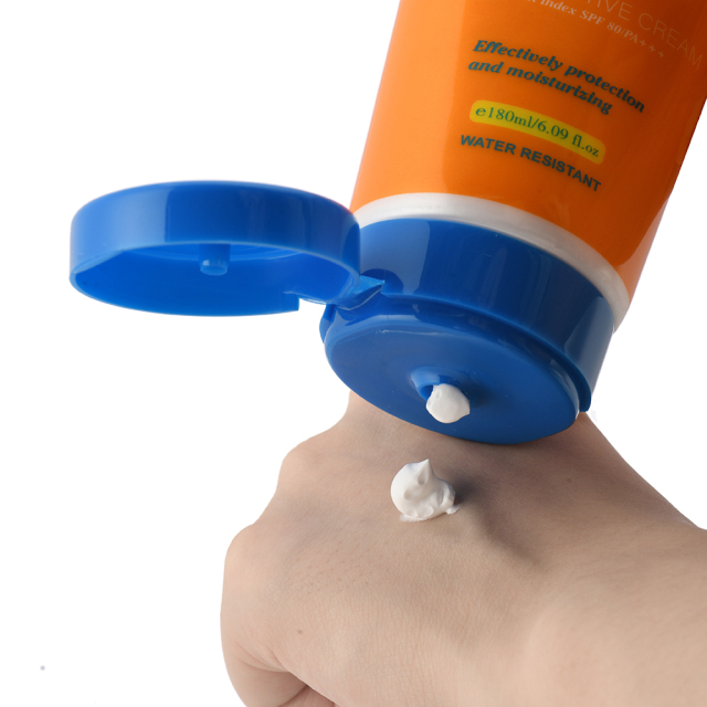 Person applying Daqan SPF80 Sunscreen for sun protection and skin brightening