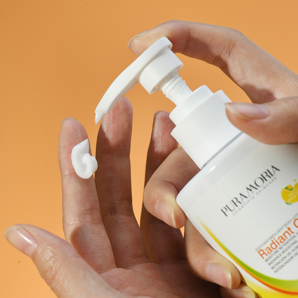 Close‑up of PURAMORIA Brightening Body Lotion texture in hand, creamy formula ideal for bulk order sampling