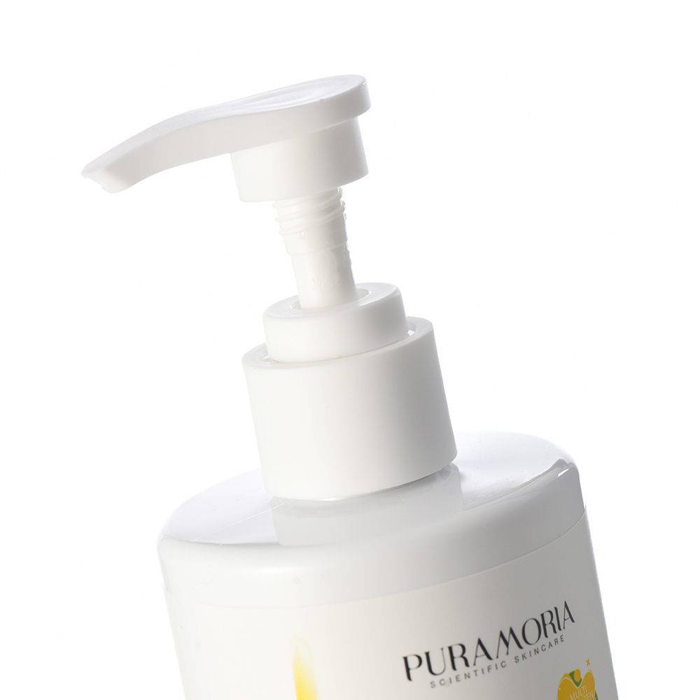 Applying PURAMORIA body lotion on forearm in bright bathroom setting