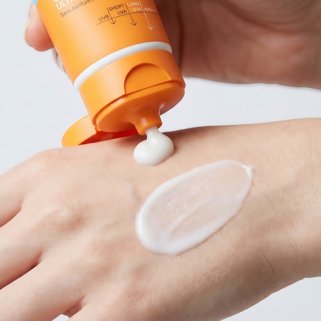 Lifestyle image showing daily application of hydrating sunscreen for face protection against UVA and UVB rays.