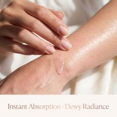 Close-up shot of BALRY Rose Essential Body Oil on skin, demonstrating a lightweight pink oil texture with instant absorption and dewy radiance for private label beauty brands.