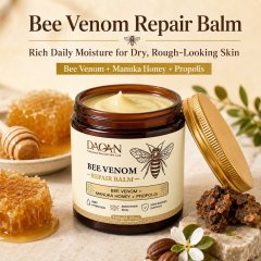 Open 120g jar of DAQAN Bee Venom Repair Balm displayed with honeycomb, Manuka honey, propolis, and botanical accents for dry, rough-looking skin care.