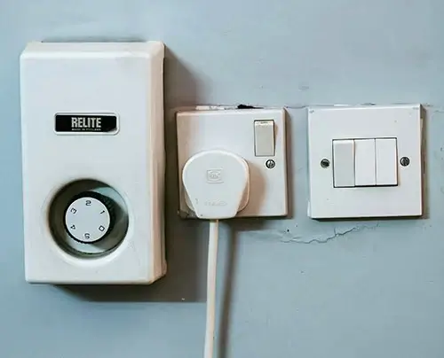 LiFePO4 Charger plugged into a wall outlet