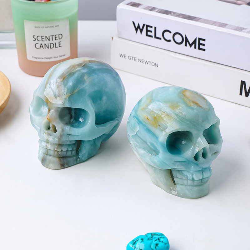 Natural crystal sky blue sky river stone skull carving piece original stone polished