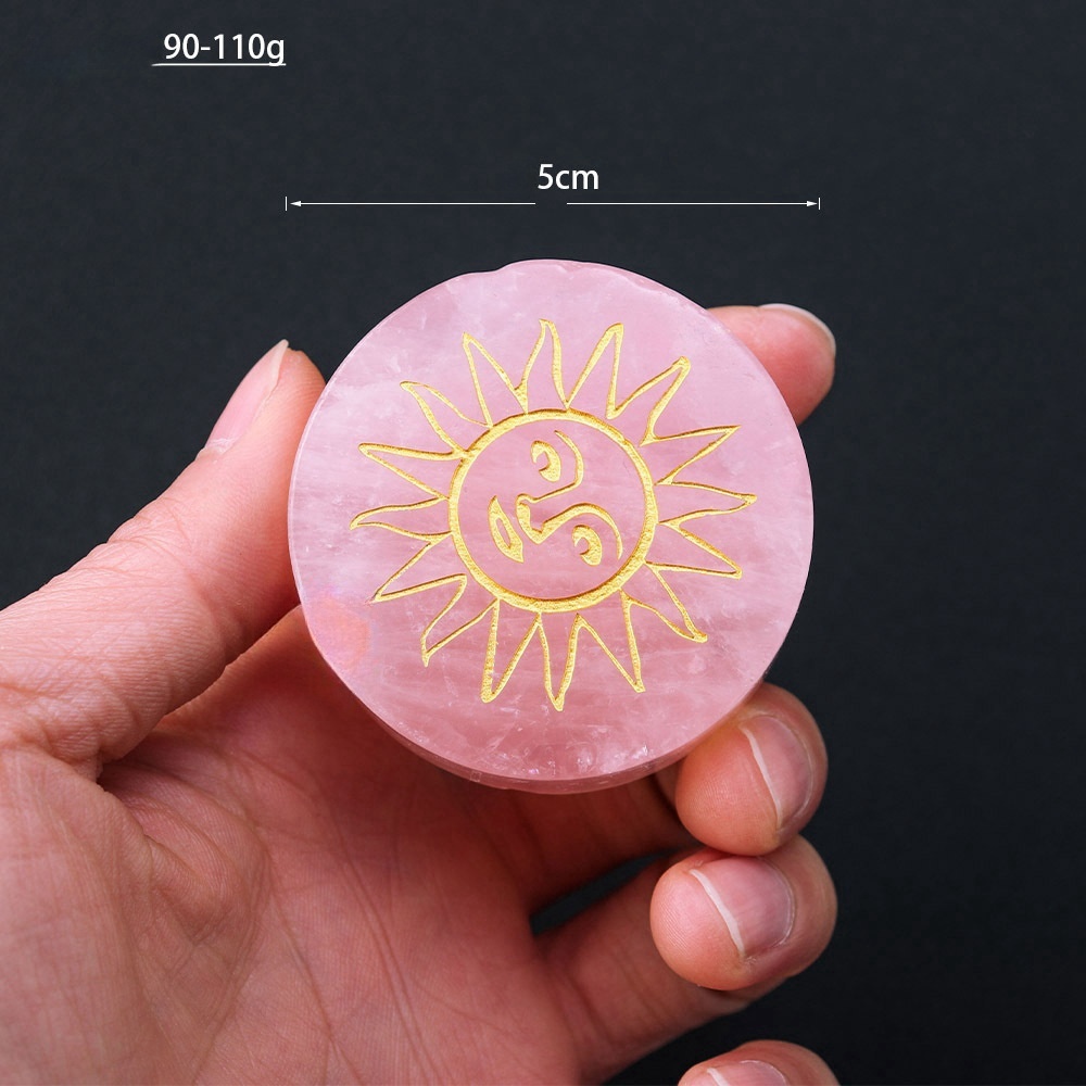 Natural rose quartz disc with laser engraved logo and gold pattern