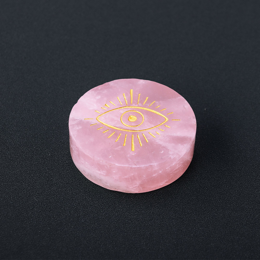 Natural rose quartz disc with laser engraved logo and gold pattern