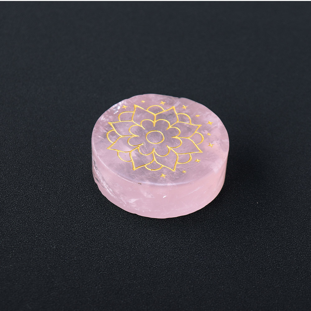 Natural rose quartz disc with laser engraved logo and gold pattern