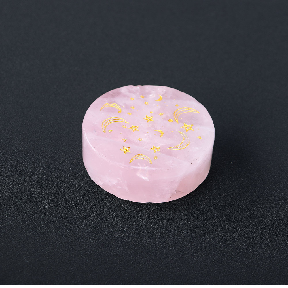 Natural rose quartz disc with laser engraved logo and gold pattern