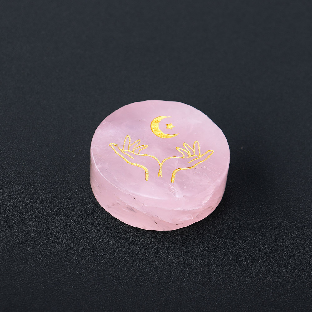 Natural rose quartz disc with laser engraved logo and gold pattern