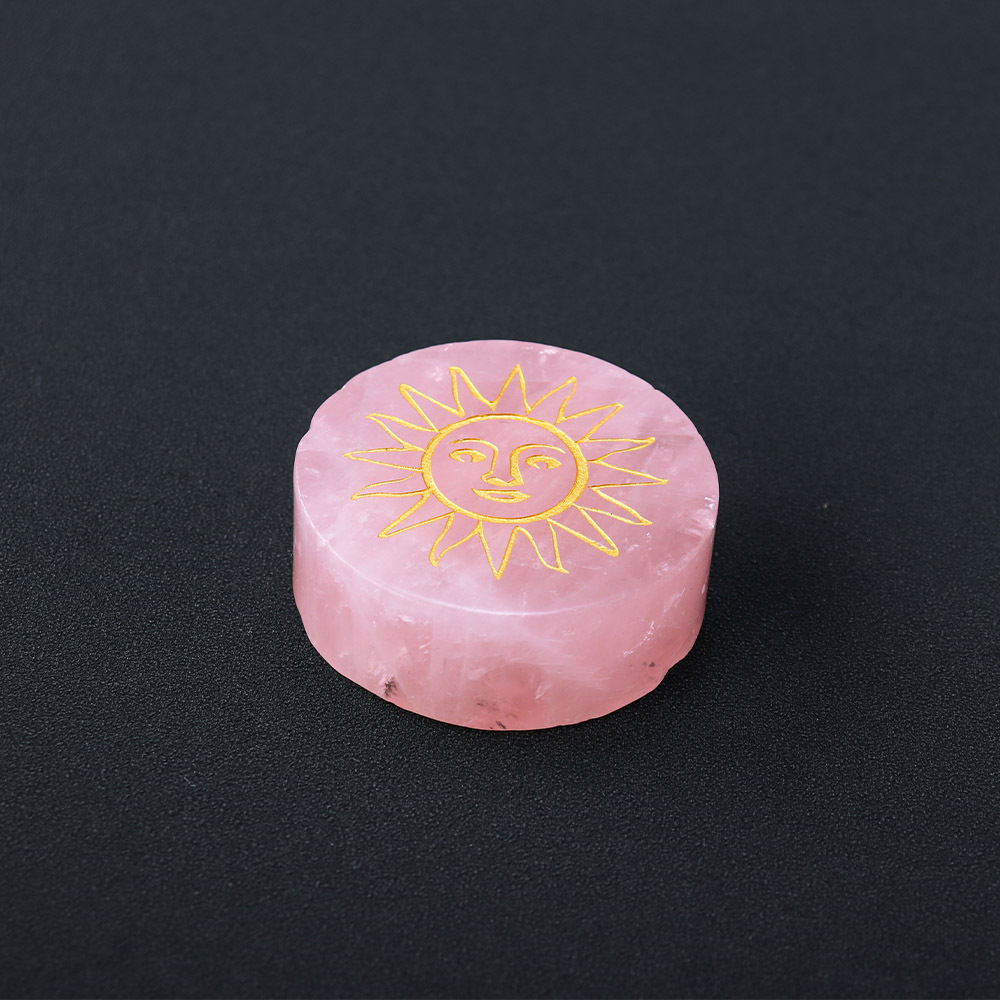 Natural rose quartz disc with laser engraved logo and gold pattern