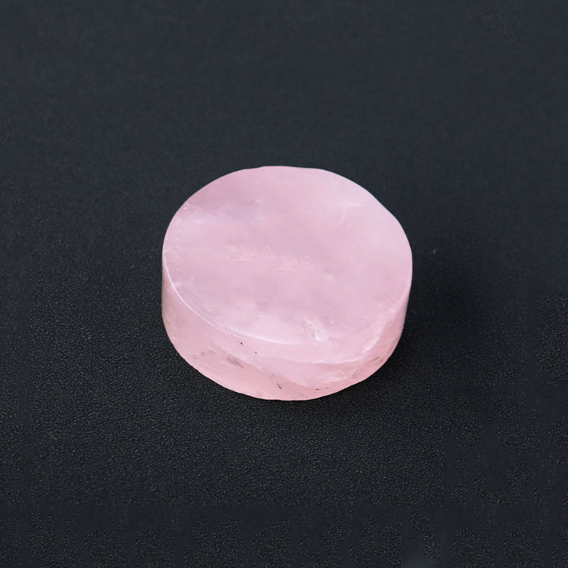 Natural rose quartz disc with laser engraved logo and gold pattern