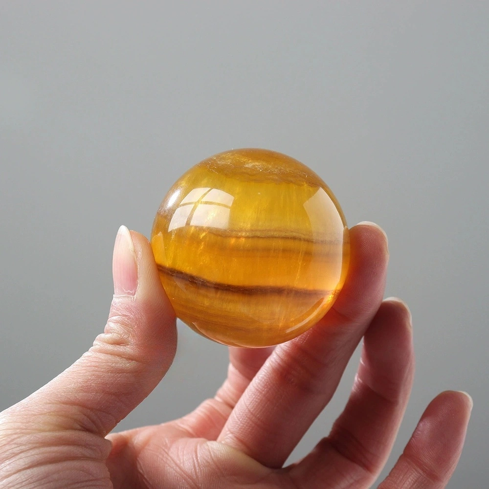 Natural crystal yellow fluorite ball raw stone hand-polished fluorite decoration