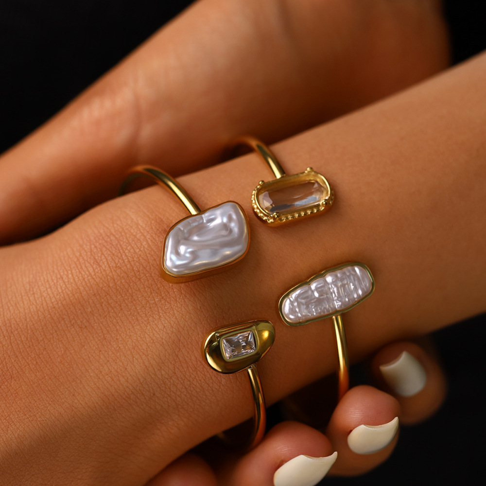 Stainless steel open bangle inlaid with irregularly shaped pearls