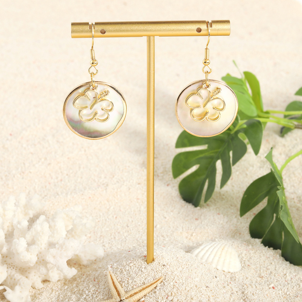 MYK1865-Tropical-style natural round black shell earrings with gold trim, island-themed earrings