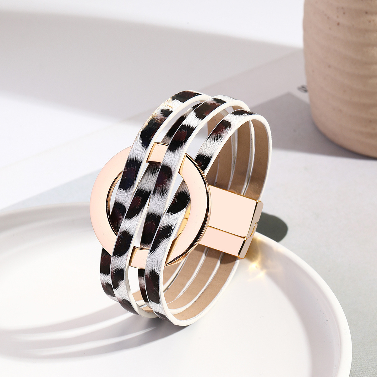 MYK1958-Cross-over leather women's bracelet with large metal ring cuff and magnetic clasp.