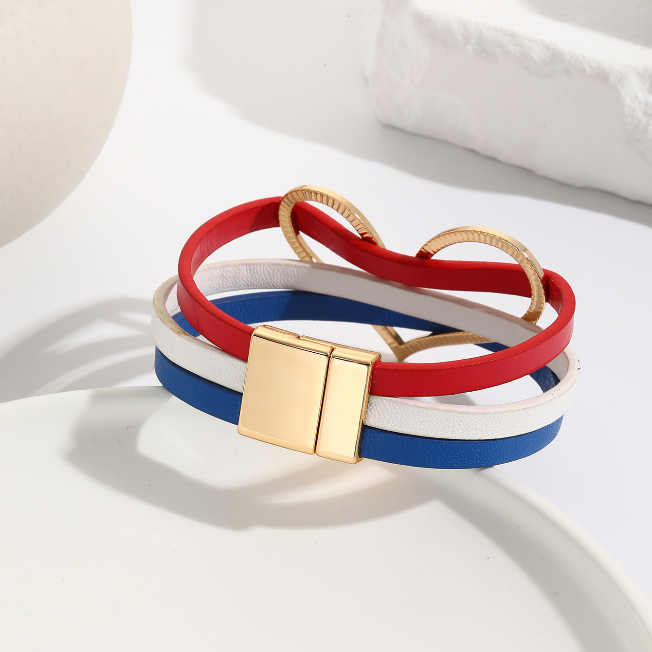 MYK2006-American flag-themed red, white, and blue heart-shaped leather bracelet with magnetic clasp.