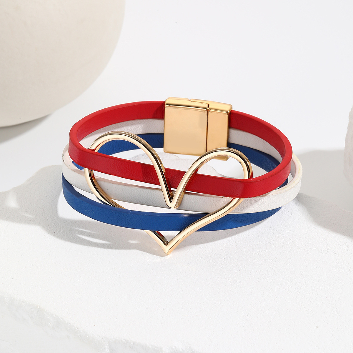 MYK2006-American flag-themed red, white, and blue heart-shaped leather bracelet with magnetic clasp.