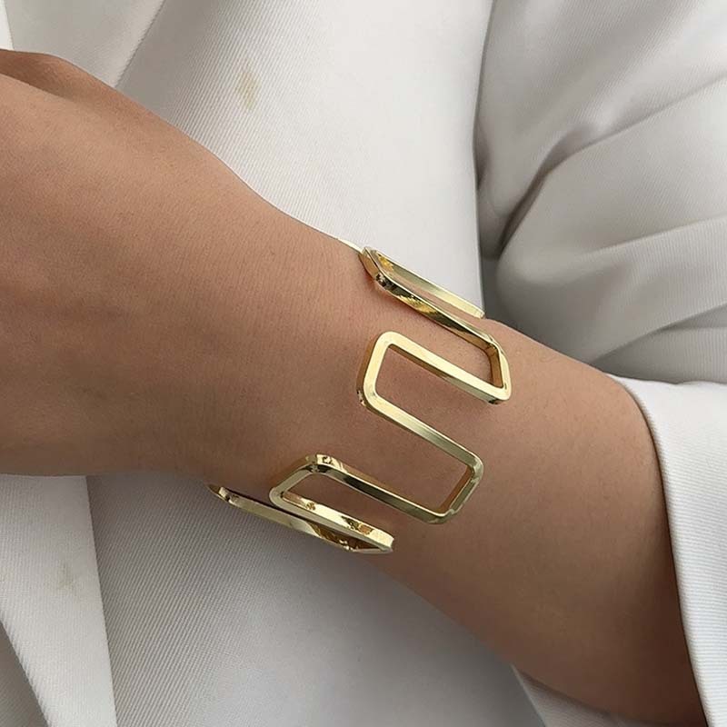 Wide, geometrically irregular, fashionable open bangle