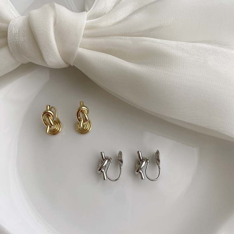 Minimalist and understated style knotted mosquito coil ear clip