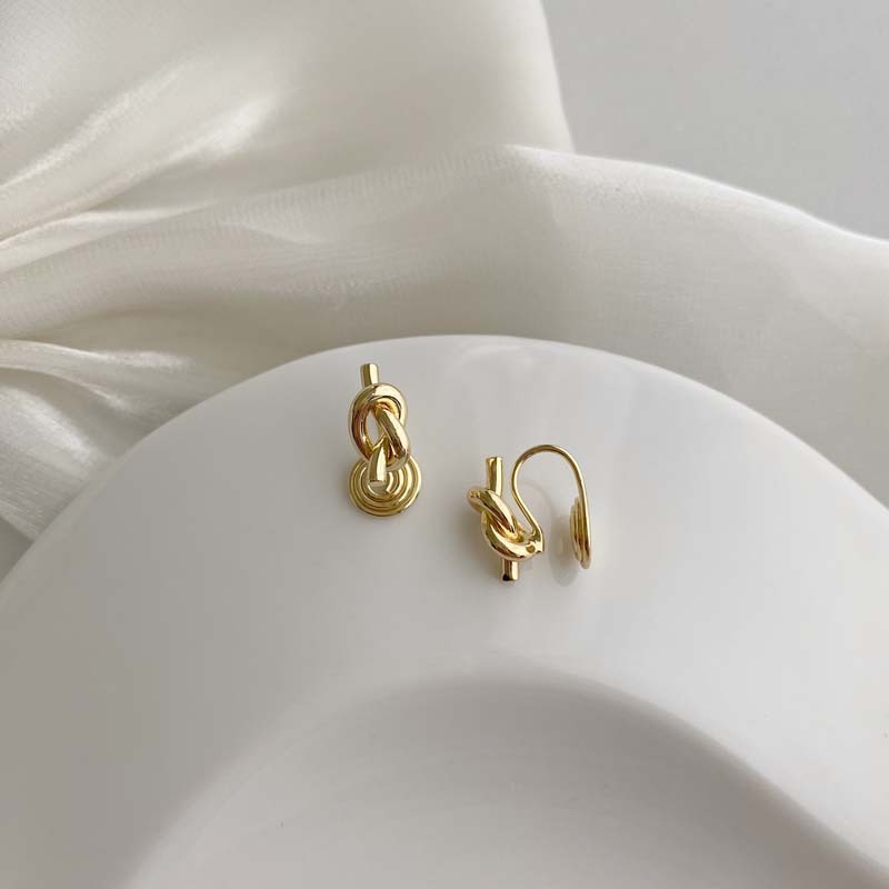 Minimalist and understated style knotted mosquito coil ear clip