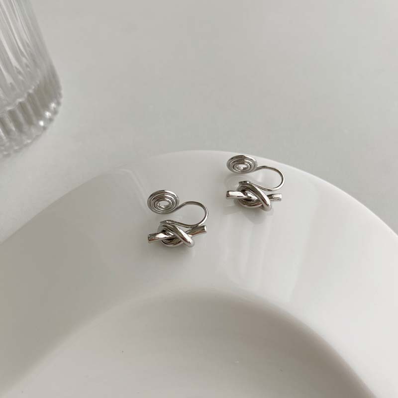 Minimalist and understated style knotted mosquito coil ear clip
