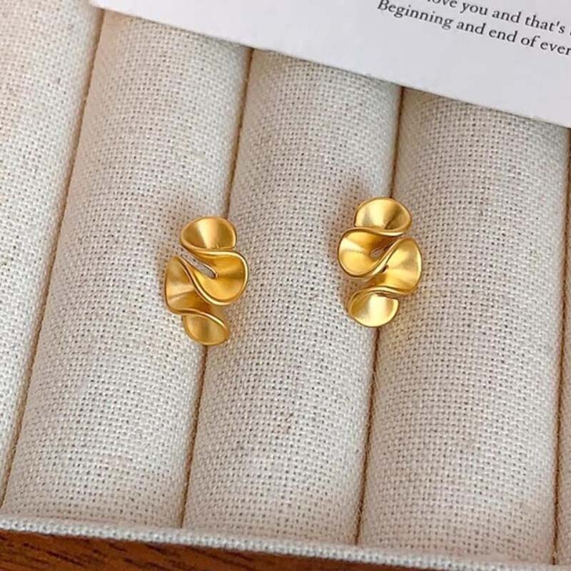 Matte gold stud earrings exude a sophisticated and luxurious feel