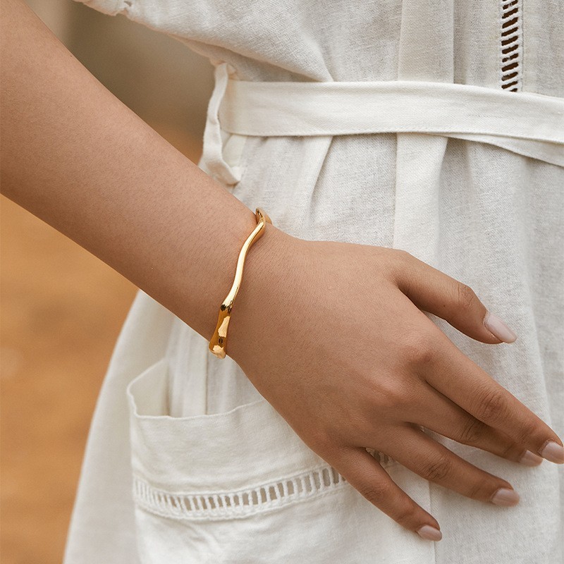 Minimalist copper bracelet with open design, stackable.