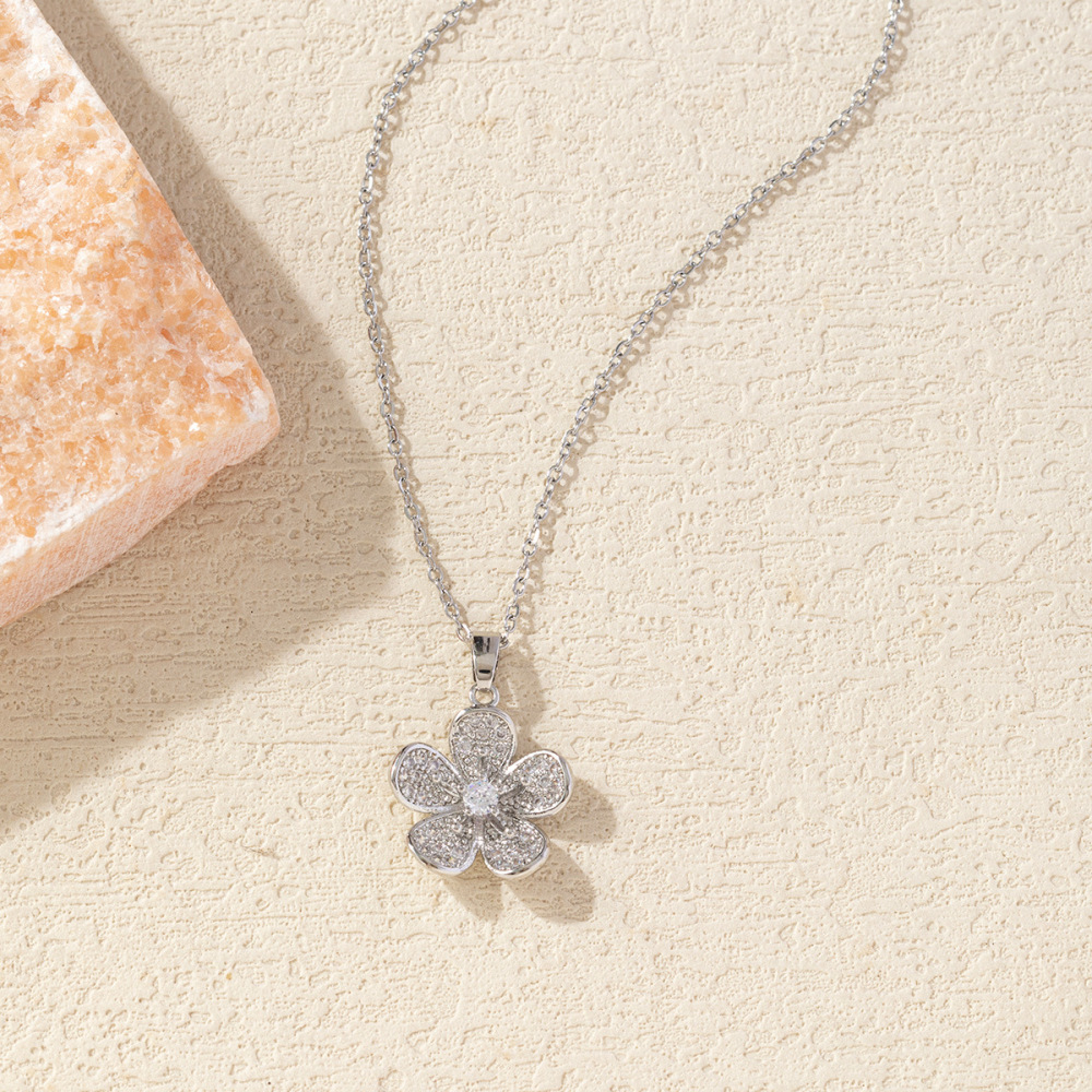 Diamond-encrusted peach blossom petal necklace with zircon