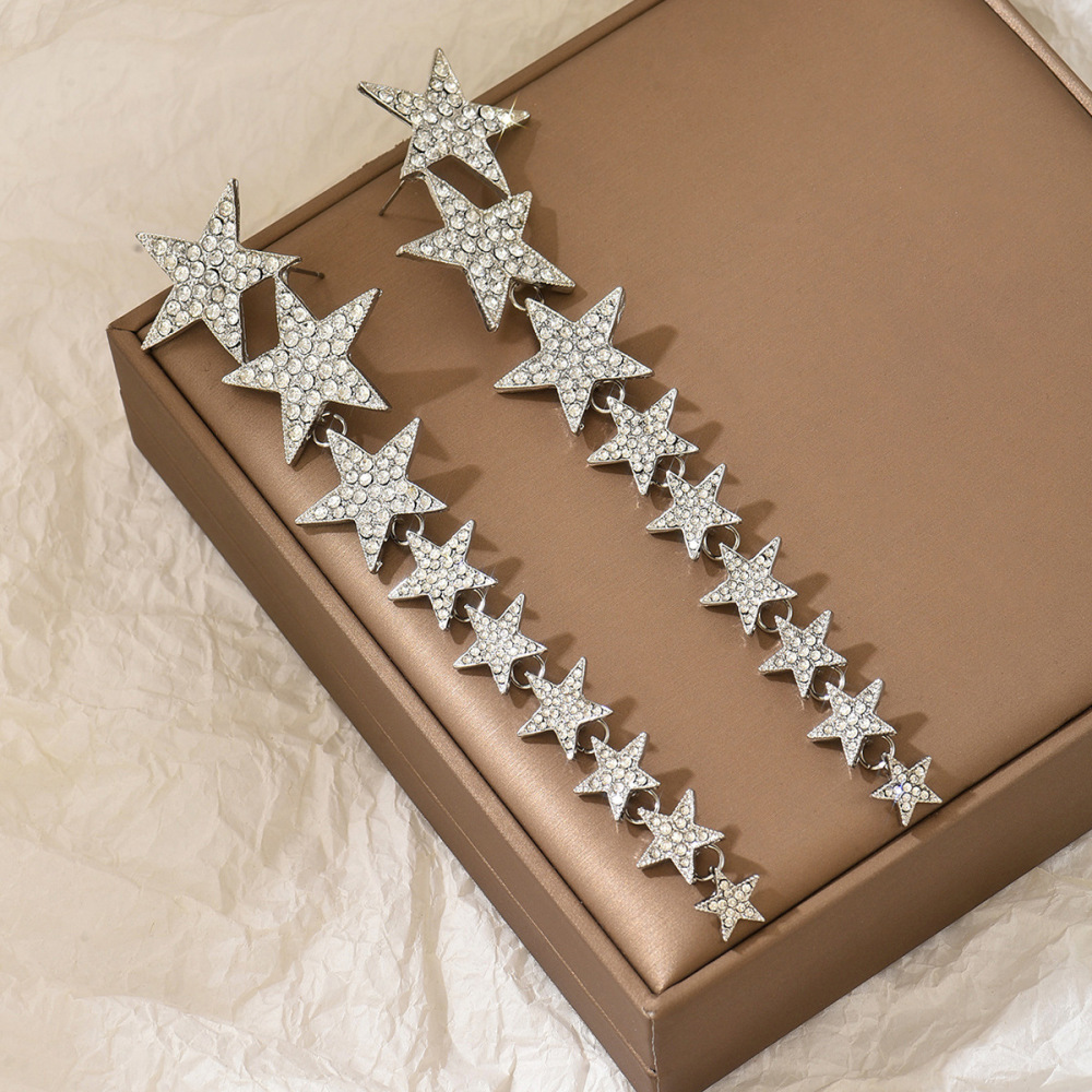 Long multi-layered star-shaped tassel earrings