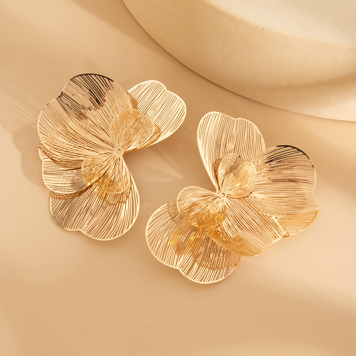 High-end openwork copper petal stud earrings