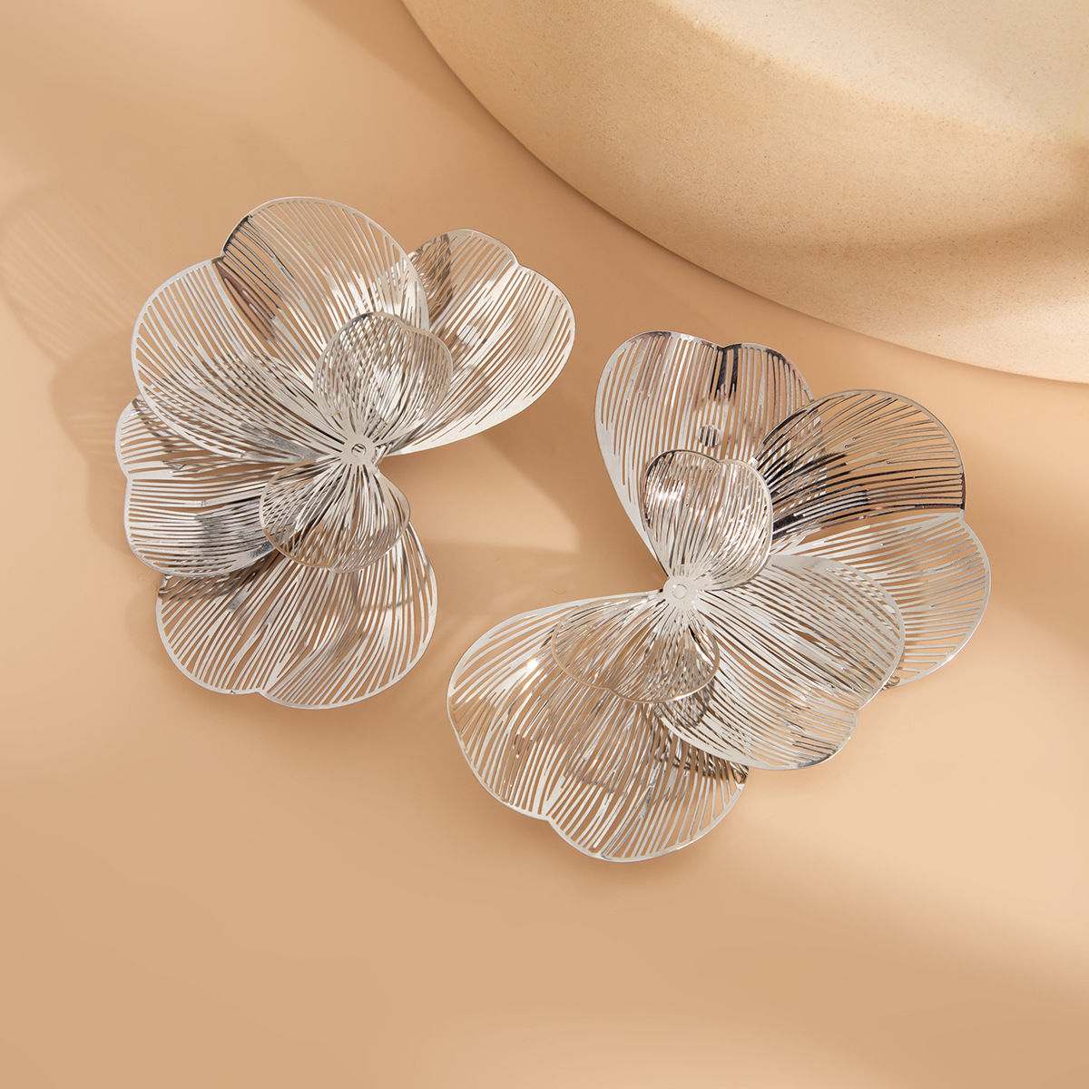 High-end openwork copper petal stud earrings