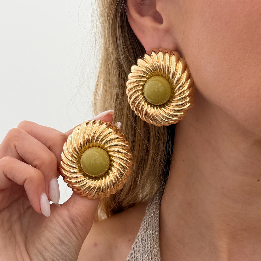 Designer-style circular alloy earrings with a spiral pattern
