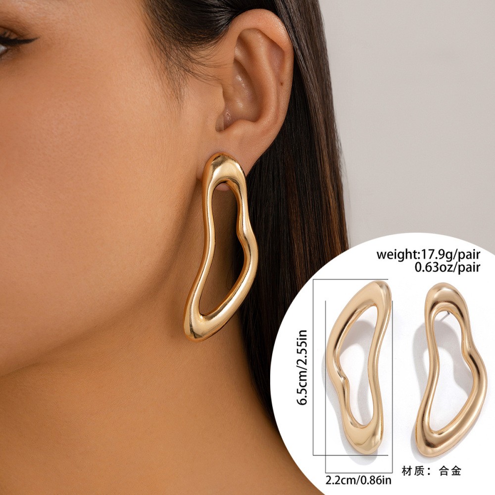 Exaggerated, irregularly shaped, openwork alloy earrings