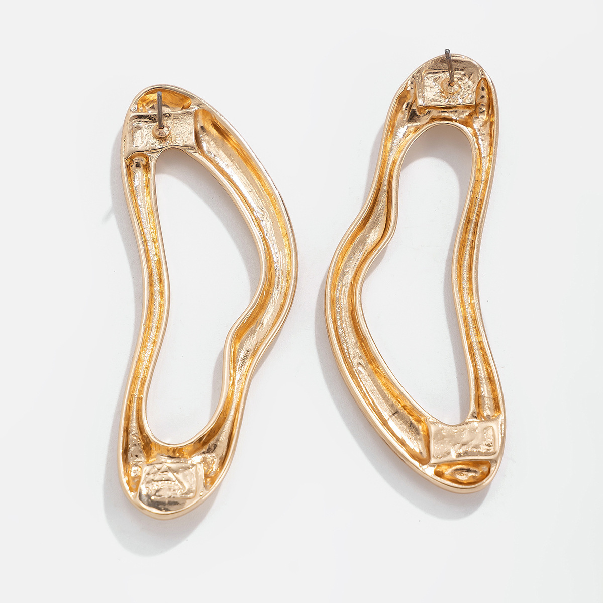 Exaggerated, irregularly shaped, openwork alloy earrings