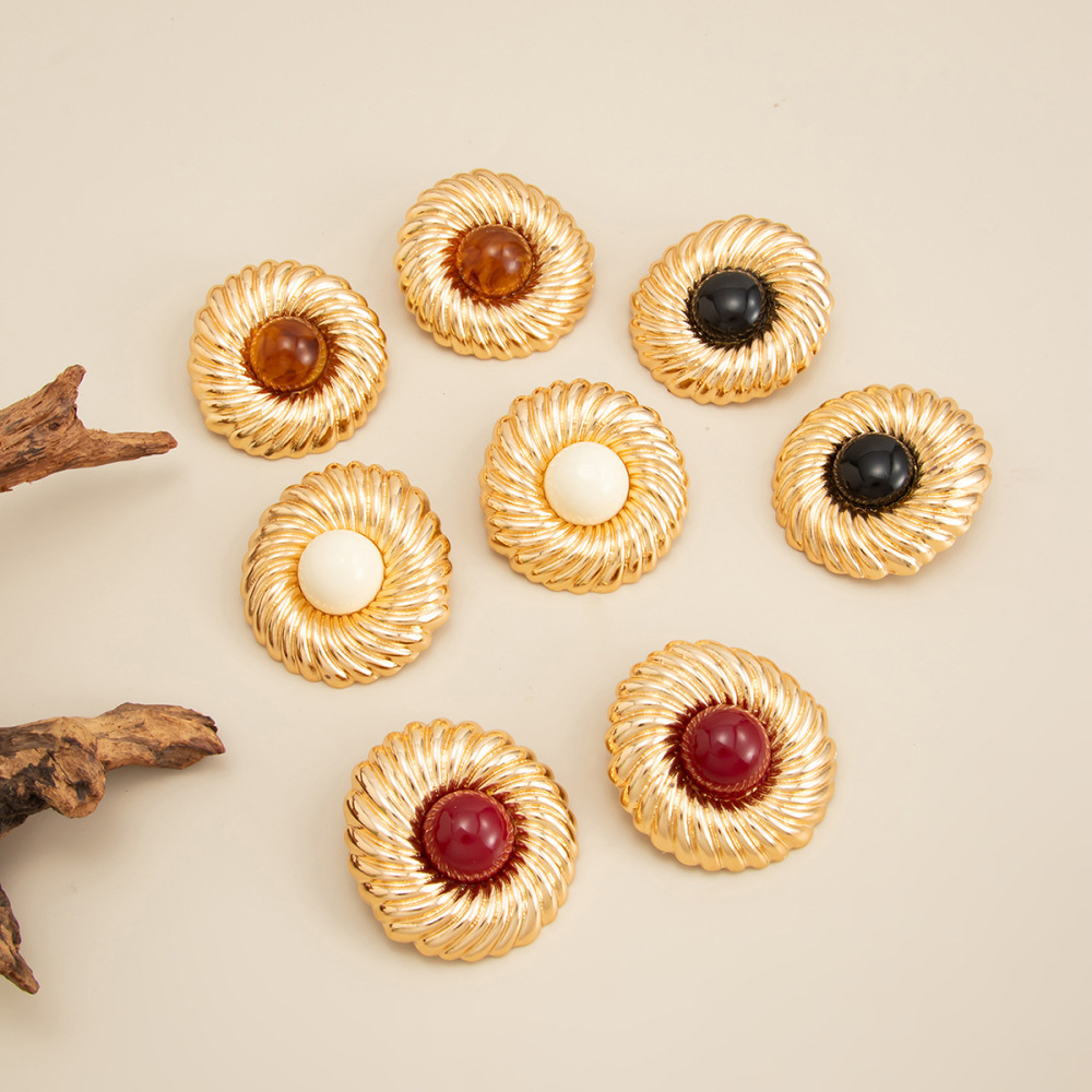 Designer-style circular alloy earrings with a spiral pattern