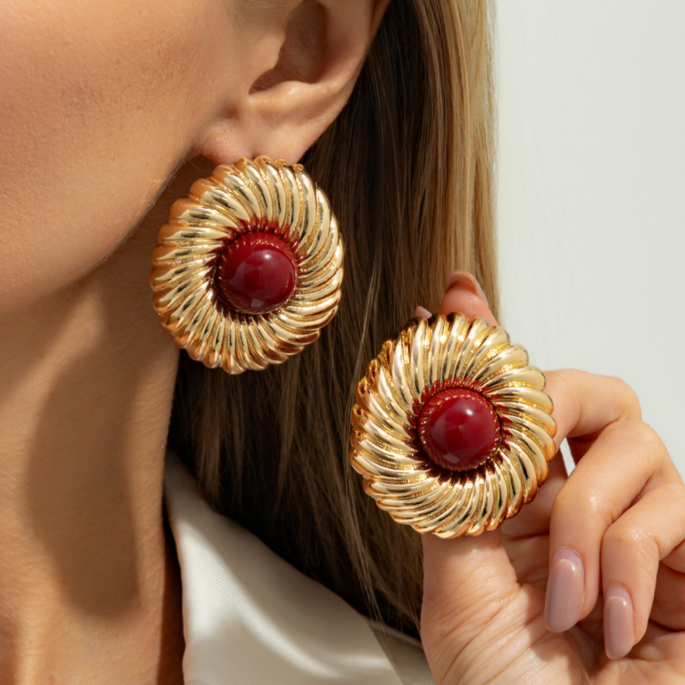 Designer-style circular alloy earrings with a spiral pattern