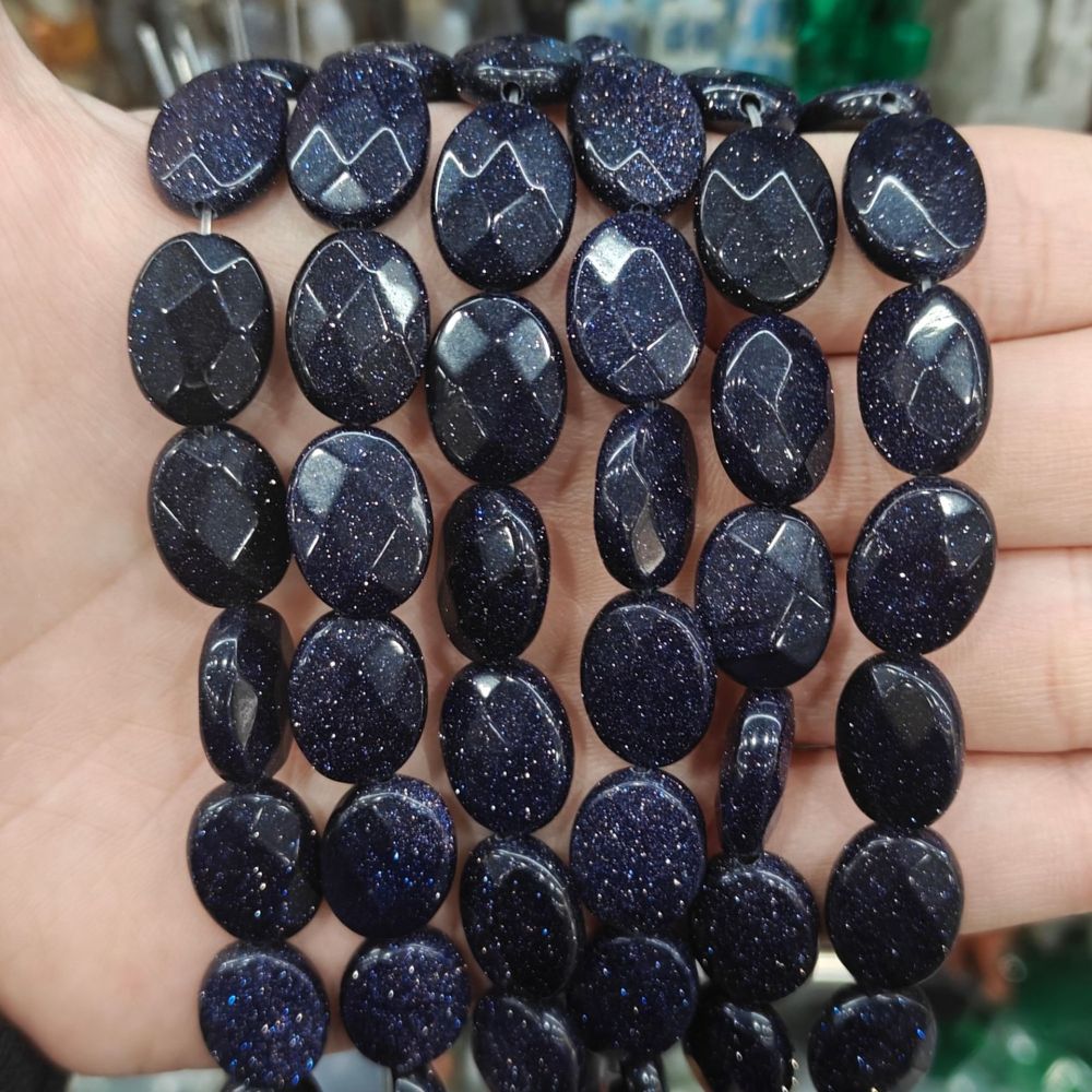 MYA3198--12x16mm Synthetic Blue Sandstone Oval-Cut Beads