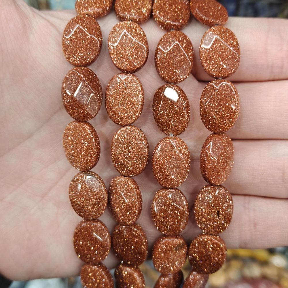 MYA3201--12x16mm Synthetic Goldstone Oval-Cut Beads