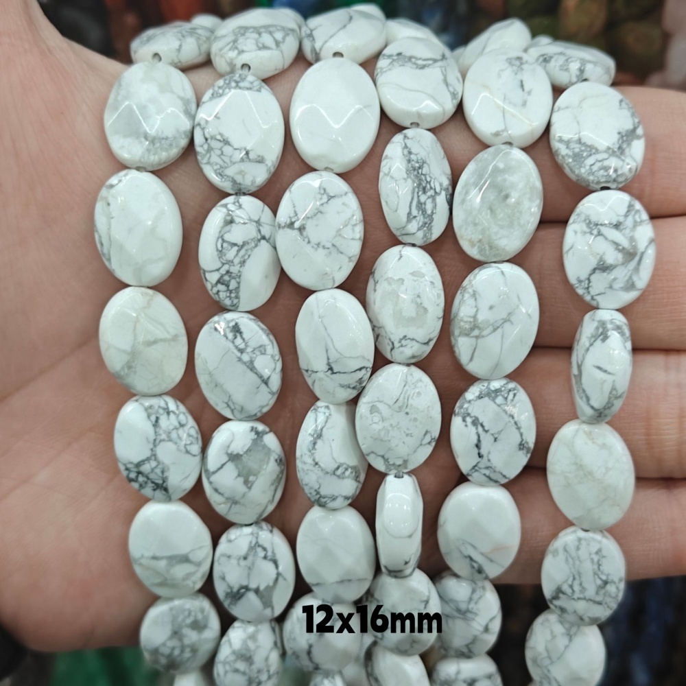MYA3209--12x16mm Natural Howlite Oval Faceted Beads