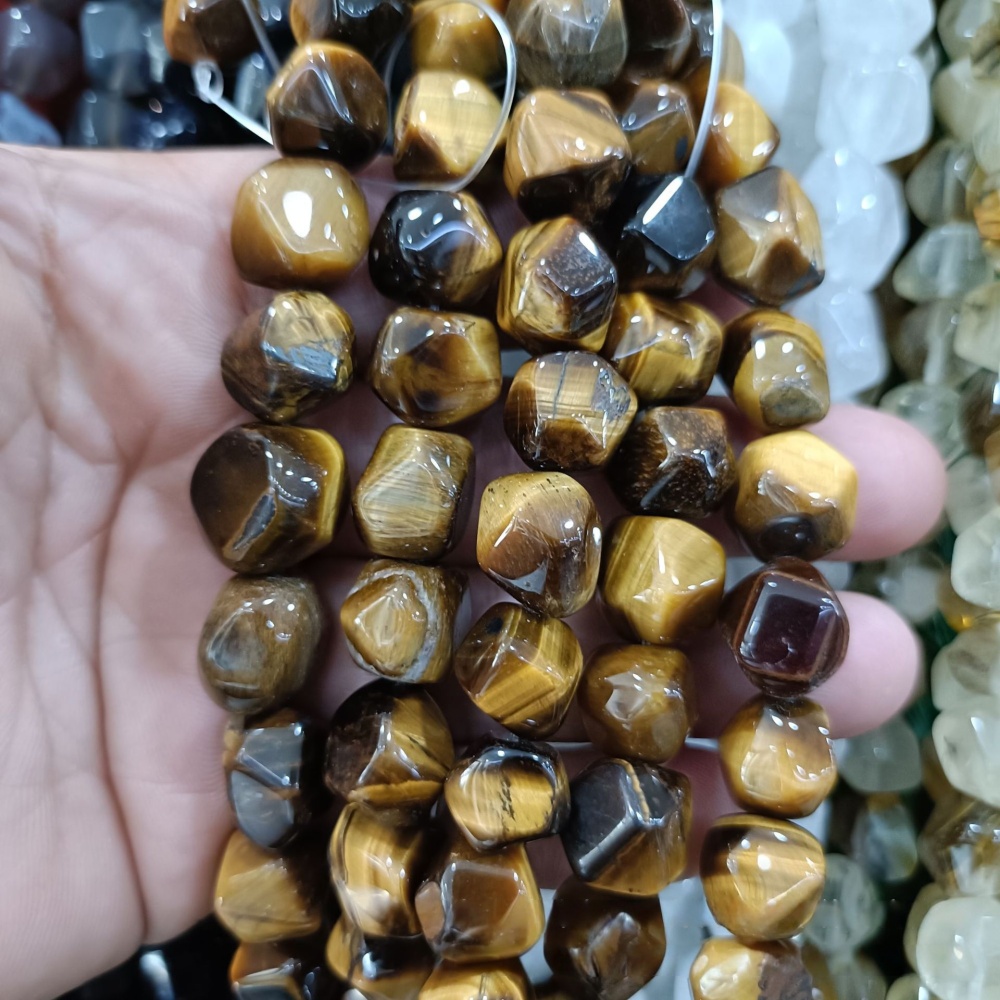MYA3228--12-16mm irregularly shaped faceted tiger's eye (loose beads)