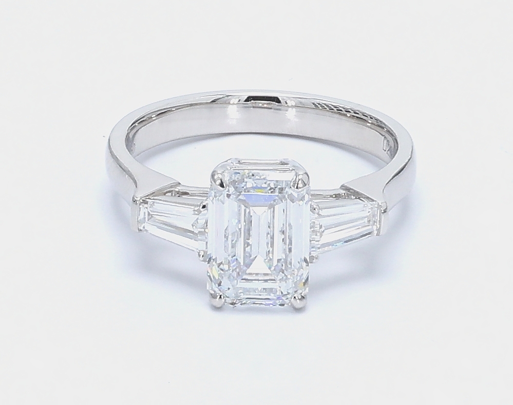 2.21 ct. Eternity Center Emerald Stone With 2 Trapezoid Side Stone Engagement Ring
