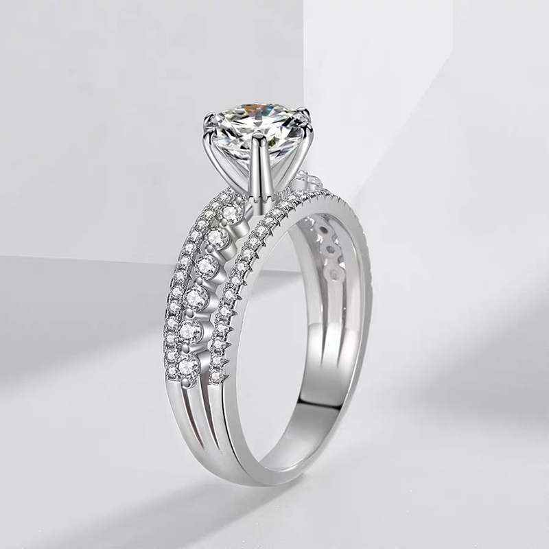 Claw-set solitaire diamond ring with double-row full pavé band