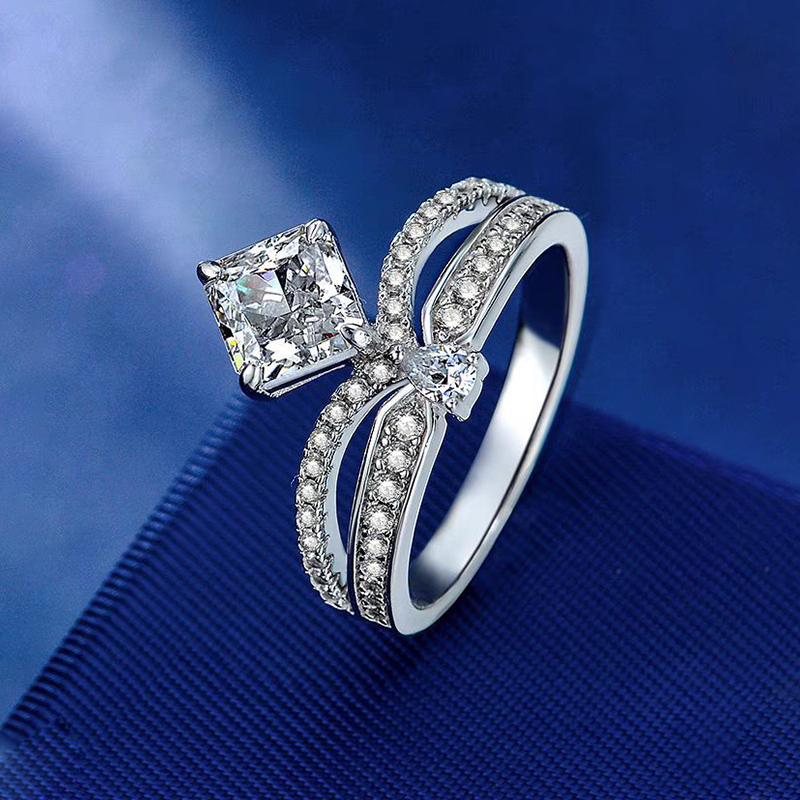 Princess-cut diamond engagement ring set with intertwined diamond - encrusted bands