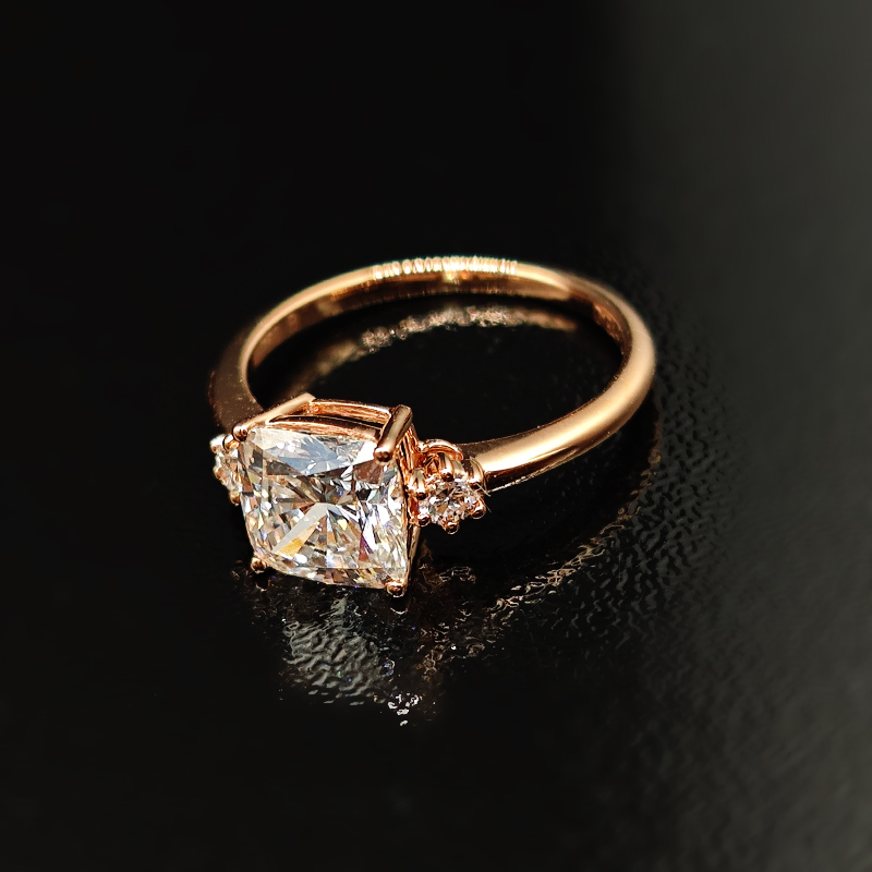 Cushion-cut diamond ring with three-life stone design