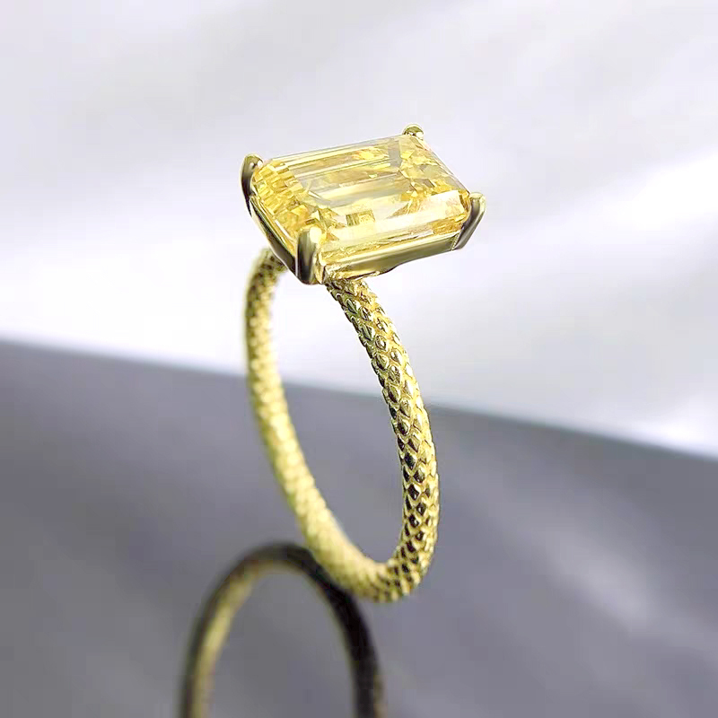 Emerald-cut diamond ring with a snake scale design