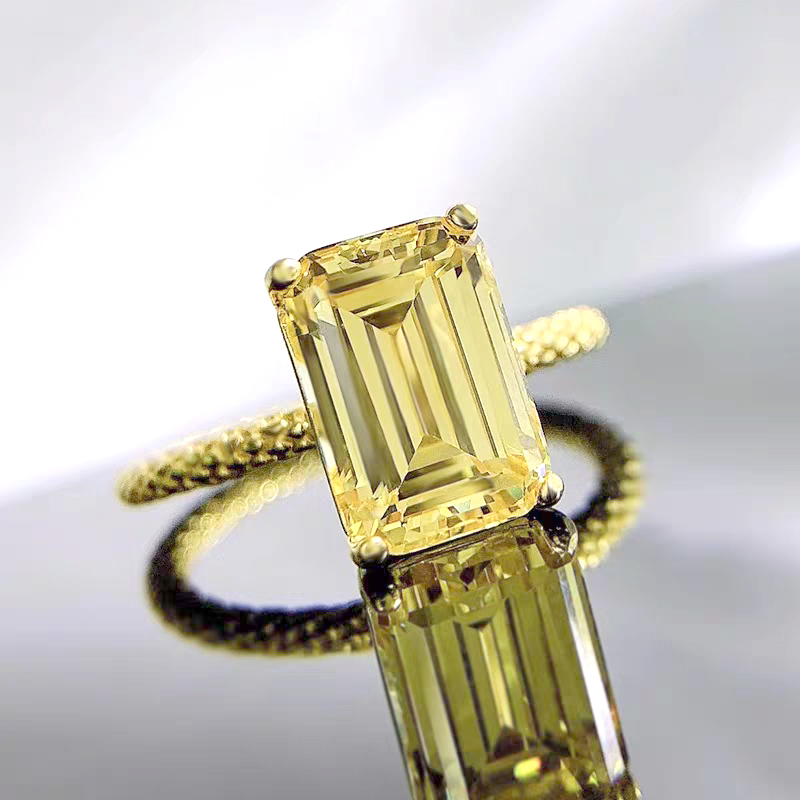 Emerald-cut diamond ring with a snake scale design