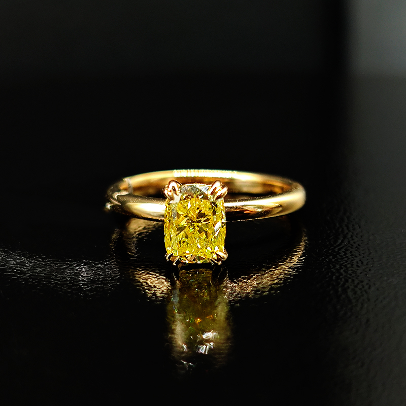 Cushion-cut yellow diamond ring with a plain shank