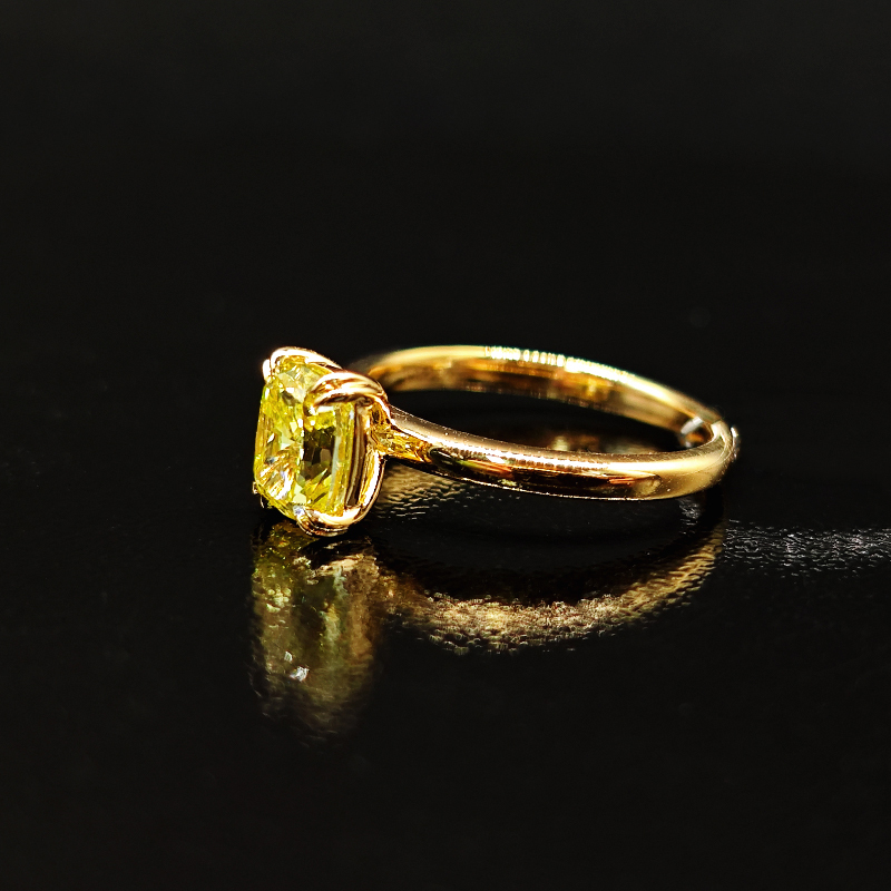 Cushion-cut yellow diamond ring with a plain shank