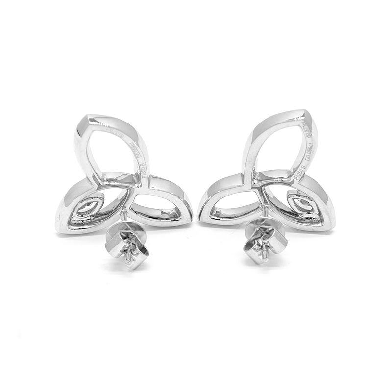 Close-up of trinity hollow leaf pave lab grown diamond stud earrings
