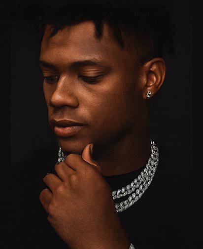 Man wearing layered iced out chains